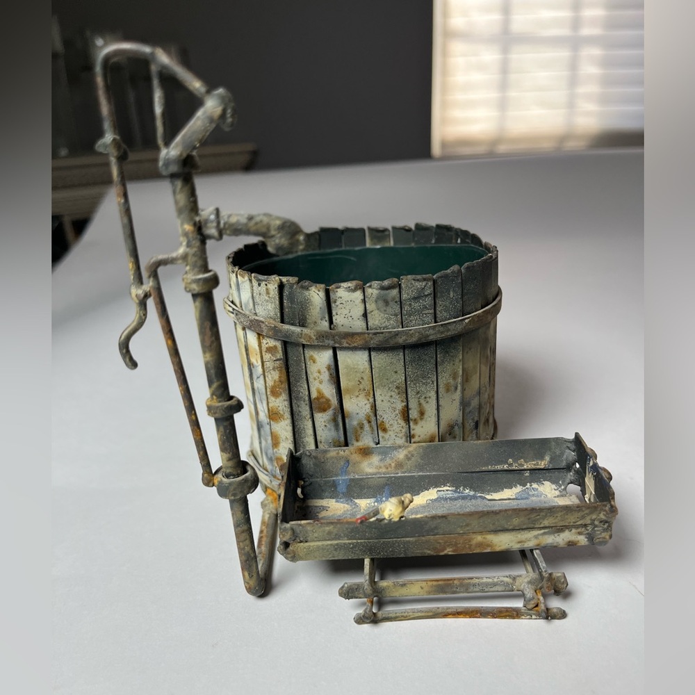 Weathered looking water pump metal planter.Perfect for indoor or outdoor plants
